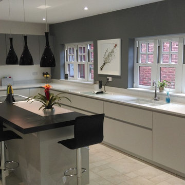 Contemporary, matt grey kitchen with island & breakfast bar