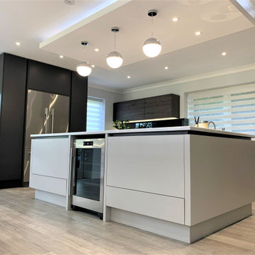 Contemporary Monochromatic Kitchen And Dining Space