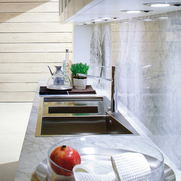 Contemporary off white kitchen with carrara marble countertop