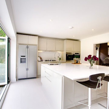 Contemporary open plan kitchen with quartz worktop and large island