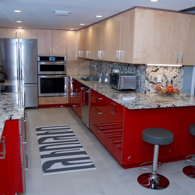 Inspiration for a large contemporary galley kitchen remodel in Miami with an undermount sink, flat-panel cabinets, red cabinets, granite countertops, stainless steel appliances and a peninsula