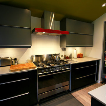 Contemporary Slab Kitchen with a Splash of colour