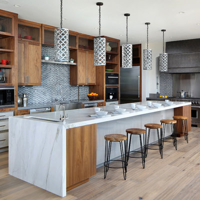 Inspiration for a large contemporary l-shaped light wood floor and beige floor kitchen remodel in San Francisco with an undermount sink, open cabinets, medium tone wood cabinets, multicolored backsplash, stainless steel appliances, an island, marble countertops and mosaic tile backsplash