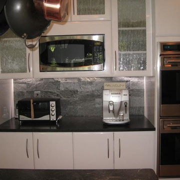 Contemporary white gloss kitchen in Newton