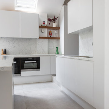 Contemporary White Handless Kitchen by Neil Norton Design