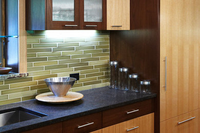 Large trendy l-shaped light wood floor eat-in kitchen photo in New York with an undermount sink, flat-panel cabinets, light wood cabinets, marble countertops, green backsplash, matchstick tile backsplash, stainless steel appliances and an island