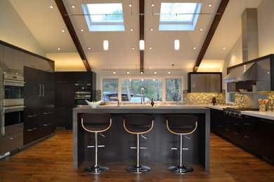 Eat-in kitchen - huge contemporary l-shaped dark wood floor eat-in kitchen idea in San Francisco with an undermount sink, flat-panel cabinets, dark wood cabinets, quartz countertops, blue backsplash, mosaic tile backsplash, stainless steel appliances and an island