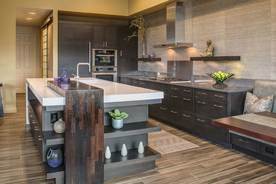 Eat-in kitchen - mid-sized contemporary galley eat-in kitchen idea in Miami with flat-panel cabinets, dark wood cabinets, quartz countertops and an island