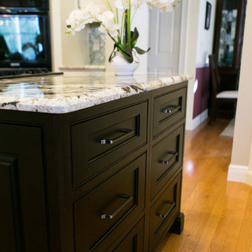 Contrasting Dark Wood Center Island in White Kitchen