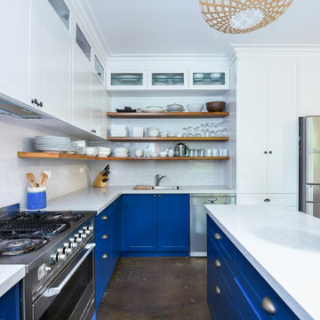Blue kitchen with white benchtops