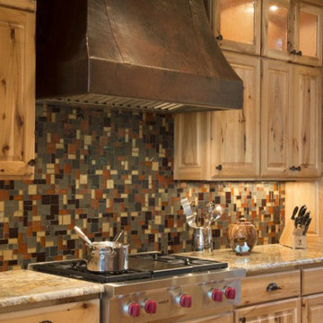 Copper range hood in a rustic kitchen Golden Eagle Log and Timber Homes