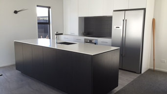 Corian benchtops with black and white cabinetry
