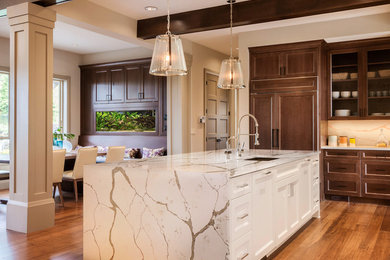 Example of a transitional eat-in kitchen design in Philadelphia with quartz countertops and an island