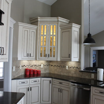 Corner cabinet with glass doors and interior lighting