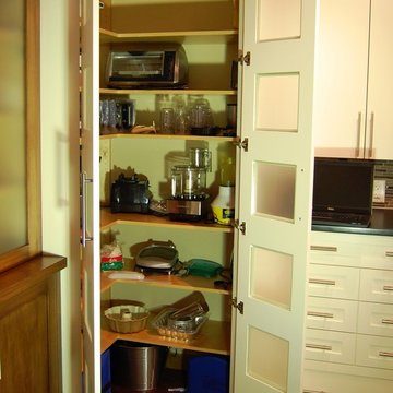 Corner walk-in pantry within the cabinetry