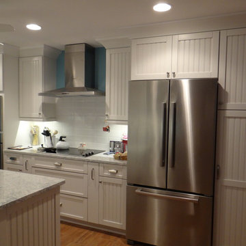 Cottage Galley kitchen with functional island