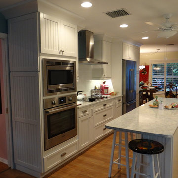 Cottage Galley kitchen with functional island