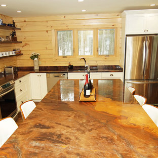 Photo of a mid-sized country l-shaped eat-in kitchen in Other with an undermount sink, shaker cabinets, white cabinets, granite benchtops, brown splashback, timber splashback, stainless steel appliances, medium hardwood floors, with island, brown floor and orange benchtop.