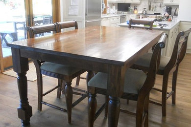 Counter high farm table with turned legs.
