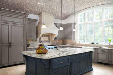 Inspiration for a mid-sized transitional l-shaped porcelain tile and beige floor enclosed kitchen remodel in Orange County with a farmhouse sink, recessed-panel cabinets, gray cabinets, granite countertops, beige backsplash, porcelain backsplash, paneled appliances and an island