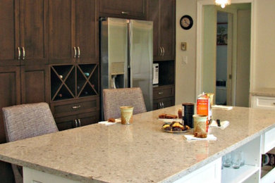 Mid-sized transitional l-shaped eat-in kitchen photo in Other with shaker cabinets and an island