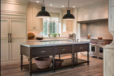 Inspiration for a farmhouse light wood floor eat-in kitchen remodel in Chicago with gray backsplash, stainless steel appliances and an island