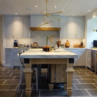 Design ideas for an expansive transitional l-shaped eat-in kitchen in Philadelphia with a double-bowl sink, shaker cabinets, grey cabinets, marble benchtops, grey splashback, stone slab splashback, stainless steel appliances, slate floors and with island.