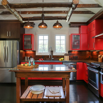 Country house with a modern kitchen and tobacco barn inspired screened porch.