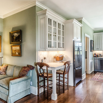 Example of a classic kitchen design in Bridgeport with a farmhouse sink, raised-panel cabinets, white cabinets and stainless steel appliances