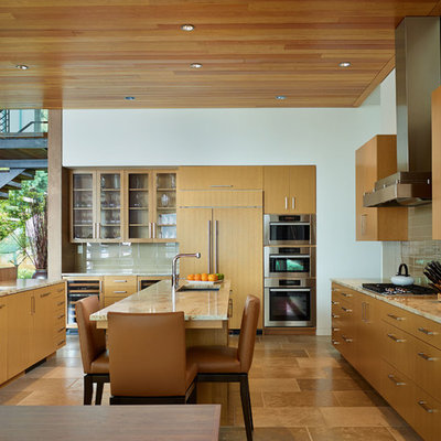 Inspiration for a contemporary kitchen remodel in Seattle with flat-panel cabinets, granite countertops and paneled appliances