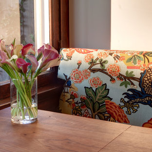 Mid-sized traditional eat-in kitchen ideas - Inspiration for a mid-sized timeless galley medium tone wood floor eat-in kitchen remodel in Los Angeles with a farmhouse sink, shaker cabinets, beige cabinets, wood countertops, multicolored backsplash, ceramic backsplash, stainless steel appliances and an island