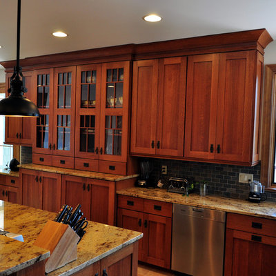 Example of a huge arts and crafts u-shaped ceramic tile eat-in kitchen design in Other with an undermount sink, shaker cabinets, medium tone wood cabinets, granite countertops, multicolored backsplash, stone tile backsplash, stainless steel appliances and an island