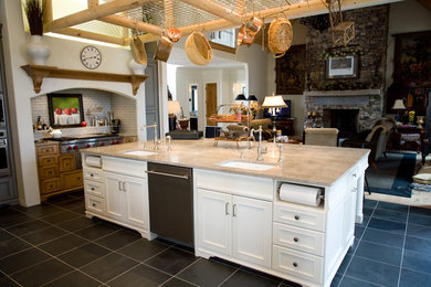 Eat-in kitchen - large traditional l-shaped slate floor and gray floor eat-in kitchen idea in Atlanta with an undermount sink, flat-panel cabinets, white cabinets, granite countertops, gray backsplash, travertine backsplash, stainless steel appliances, an island and beige countertops