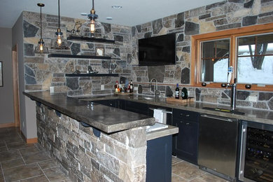 Enclosed kitchen - mid-sized rustic galley ceramic tile enclosed kitchen idea in Other with an undermount sink, shaker cabinets, blue cabinets, concrete countertops, multicolored backsplash, stainless steel appliances and a peninsula