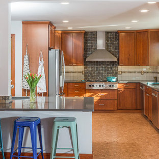 This is an example of a mid-sized transitional u-shaped eat-in kitchen in Other with an undermount sink, shaker cabinets, medium wood cabinets, quartz benchtops, slate splashback, stainless steel appliances, cork floors, with island, brown floor and grey benchtop.