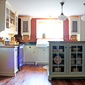 Cream Farmhouse Kitchen with Green Island & Paneled Dishwasher