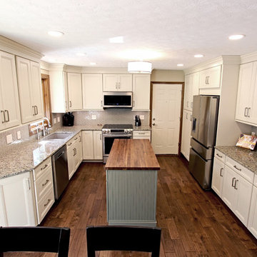 Cream Kitchen with Green Island with Butcher Block Countertop