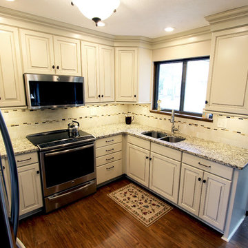 Cream Painted Waypoint Cabinets with Granite Countertops