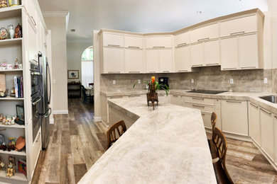 Example of a mid-sized classic galley porcelain tile and beige floor eat-in kitchen design in Miami with a single-bowl sink, beaded inset cabinets, white cabinets, marble countertops, white backsplash, marble backsplash, stainless steel appliances, an island and white countertops