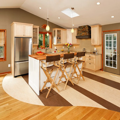 Open concept kitchen - small craftsman l-shaped linoleum floor open concept kitchen idea in DC Metro with an undermount sink, shaker cabinets, light wood cabinets, granite countertops, beige backsplash, glass tile backsplash, stainless steel appliances and an island
