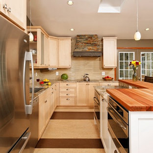 Inspiration for a small arts and crafts l-shaped open plan kitchen in DC Metro with an undermount sink, shaker cabinets, light wood cabinets, granite benchtops, beige splashback, glass tile splashback, stainless steel appliances, linoleum floors and with island.