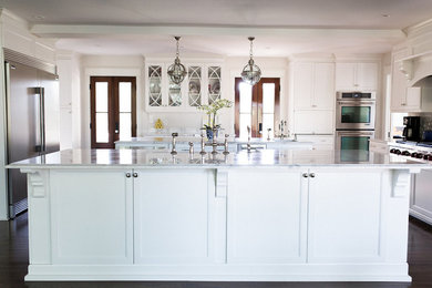 Example of a large transitional kitchen design in Charleston with a farmhouse sink and an island