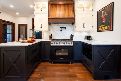 Inspiration for a mid-sized transitional u-shaped medium tone wood floor enclosed kitchen remodel in New York with an undermount sink, beaded inset cabinets, beige cabinets, quartz countertops, white backsplash, quartz backsplash, colored appliances, an island and white countertops