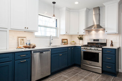 Eat-in kitchen - mid-sized contemporary l-shaped vinyl floor and gray floor eat-in kitchen idea in St Louis with an undermount sink, shaker cabinets, blue cabinets, quartz countertops, white backsplash, ceramic backsplash, stainless steel appliances and no island