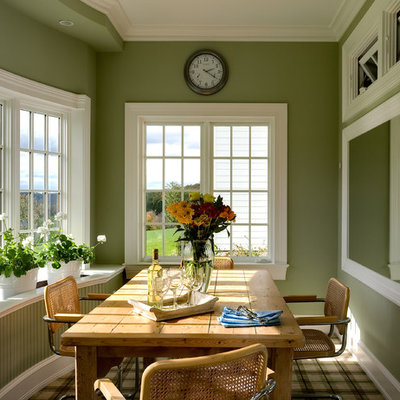 Eat-in kitchen - traditional eat-in kitchen idea in New York with an undermount sink, glass-front cabinets, white cabinets, wood countertops, white backsplash and white appliances