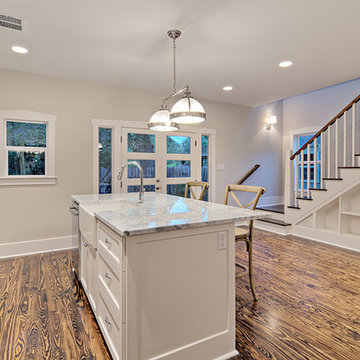 Crisp, White Kitchen with stairwell shelving