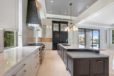Inspiration for a large contemporary l-shaped beige floor eat-in kitchen remodel in Miami with an undermount sink, shaker cabinets, white cabinets, granite countertops, white backsplash, subway tile backsplash, an island and gray countertops