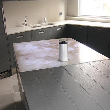 Cristallo quartzite mitred island with popup power sockets and internal lighting