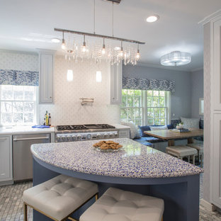 Design ideas for a mid-sized transitional single-wall eat-in kitchen in Oklahoma City with a double-bowl sink, recessed-panel cabinets, grey cabinets, recycled glass benchtops, multi-coloured splashback, mosaic tile splashback, stainless steel appliances, marble floors, with island, multi-coloured floor and white benchtop.