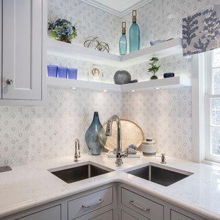 Design ideas for a mid-sized transitional single-wall eat-in kitchen in Oklahoma City with a double-bowl sink, recessed-panel cabinets, grey cabinets, recycled glass benchtops, multi-coloured splashback, mosaic tile splashback, stainless steel appliances, marble floors, with island, multi-coloured floor and white benchtop.